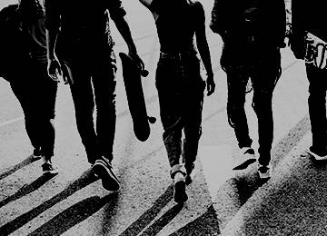 Five youths walking back turned